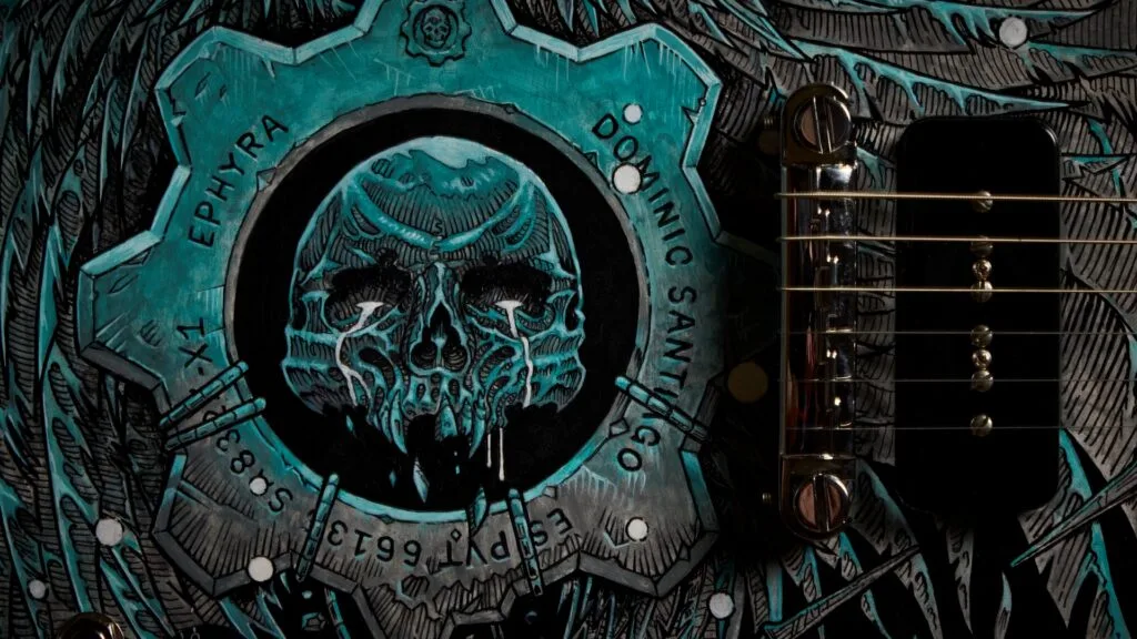 The Dominic Santiago SG: a black Gibson SG hand-painted with a teal winged skull across the body.