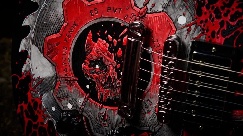 The Marcus Fenix Les Paul: a black Gibson Les Paul hand-painted with a red gear and splashed red across the body.